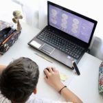 A boy learning online. Education online. School in home.Using technology.