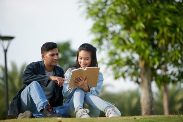 Couple Discussing Non-Fictional Book