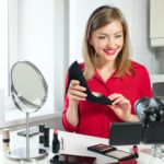 Young attractive European woman presenting her latest purchase black court shoe