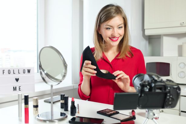Young attractive European woman presenting her latest purchase black court shoe